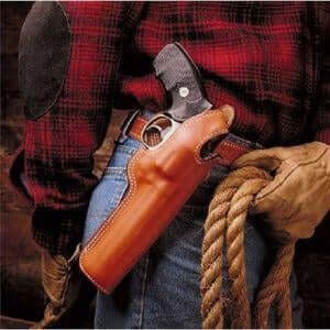 A hunter wearing a plaid shirt with a handgun in a leather holster, ready for outdoor adventures.